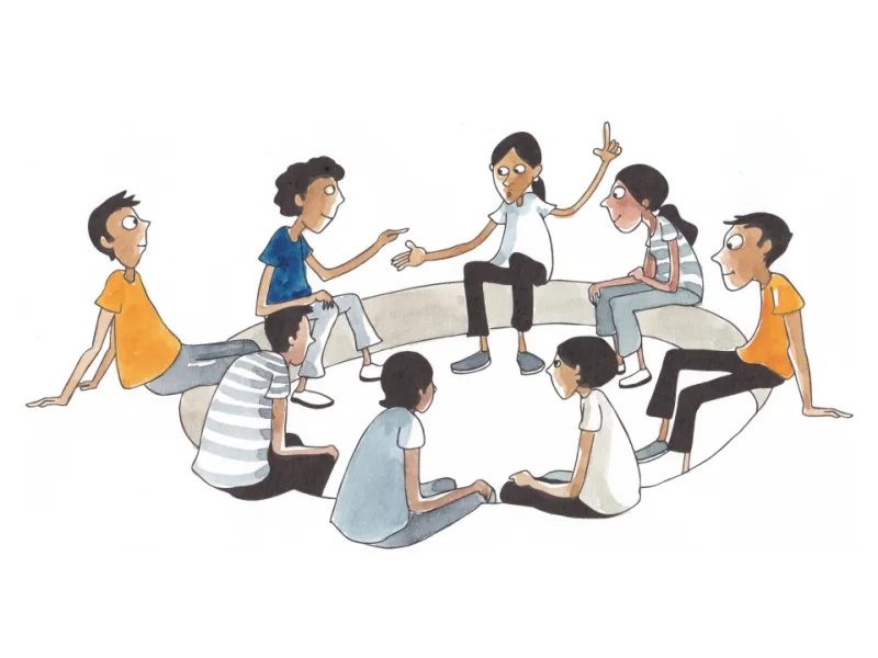 Learners working together around a table