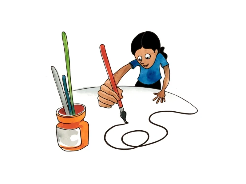 A child drawing with paintbrushes